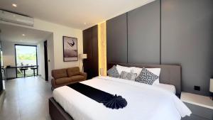 Ένα ή περισσότερα κρεβάτια σε δωμάτιο στο The R Apartments Pererenan