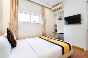 TV a/nebo společenská místnost v ubytování Golden Star Hotel