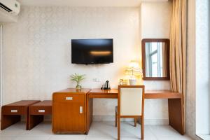 TV a/nebo společenská místnost v ubytování Golden Star Hotel