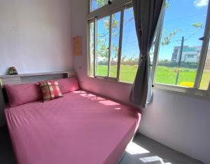 Postel nebo postele na pokoji v ubytování 豐綠民宿 Yilan Fenglu Homestay