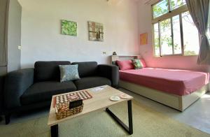 Postel nebo postele na pokoji v ubytování 豐綠民宿 Yilan Fenglu Homestay