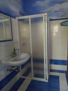 a bathroom with a shower and a sink at Casa Gialla B&B in Lipari +69 photos