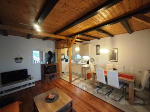 a living room with a table and a dining room at Kuća za odmor Bella in Sotin