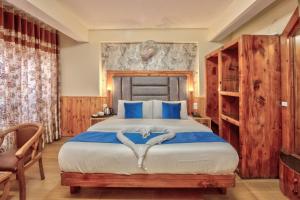 Letto o letti in una camera di Hotel Ibex