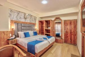 Letto o letti in una camera di Hotel Ibex