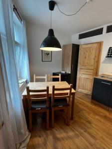 a kitchen and dining room with a table and chairs at Ferienwohnung zur Parthe in Grimma