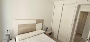 En eller flere senge i et værelse på Santa Pola Hills