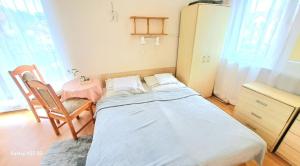 Postel nebo postele na pokoji v ubytování Pod Słoneczkiem 1