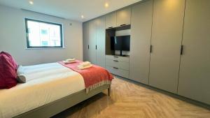 Кровать или кровати в номере Sunrise Escape 2 Bed Inc Parking