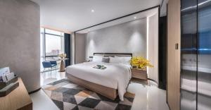 Voodi või voodid majutusasutuse Mehood Lestie, Tongxiang Wuzhen Avenue toas