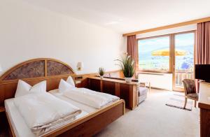 Postel nebo postele na pokoji v ubytování Hotel Schauinsland