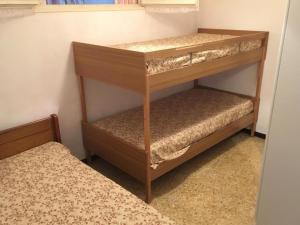 a bunk bed room with two bunk beds in a room at Mas du Prescondu in Mirabel-aux-Baronnies