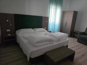 Voodi või voodid majutusasutuse Albergo Al Gambero toas