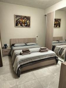 Postel nebo postele na pokoji v ubytování Serendipity, Aparment in Victoria Centre Gozo