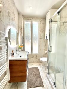 a bathroom with a sink and a shower at Villa Lila in Nice