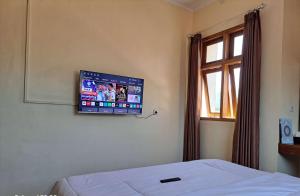 TV a/nebo společenská místnost v ubytování Cipada Guesthouse syariah