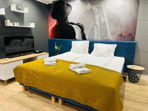 Μια τηλεόραση ή/και κέντρο ψυχαγωγίας στο Apartamenty A&M