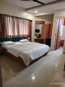 Postel nebo postele na pokoji v ubytování Hotel Vaishali
