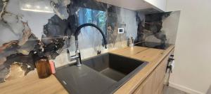Kuchyňa alebo kuchynka v ubytovaní Apartman Millá