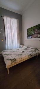 Postel nebo postele na pokoji v ubytování Tourist Homestay