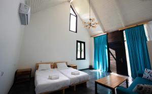 Postel nebo postele na pokoji v ubytování Vagabond - Cozy Guesthouse in Lagodekhi