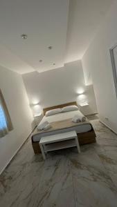 a bedroom with a bed and a table in it at Morgana Sea in Catania +40 photos