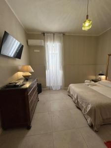 Postel nebo postele na pokoji v ubytování NOTUS Rooms Adults Only