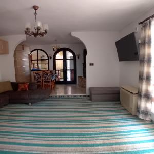A bed or beds in a room at Levendula Vendégház