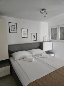 Postel nebo postele na pokoji v ubytování Apartman Stella Rovanjska