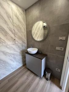 a bathroom with a sink and a mirror at Gli Oleandri in Ospedaletti