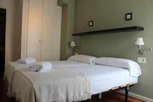 Säng eller sängar i ett rum på Aqua Apartments Oceanográfico