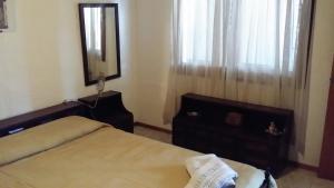 Ένα ή περισσότερα κρεβάτια σε δωμάτιο στο Hotel Centro