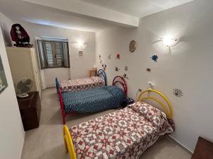 a living room with two beds and a couch at La quiete tra le montagne in Apiro