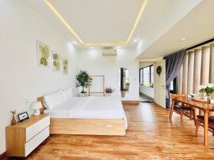 Postel nebo postele na pokoji v ubytování Cloudy Homestay Hoi An