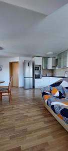 a large room with a bed and a kitchen at ITSOFT smart apartment in Komenda +25 photos
