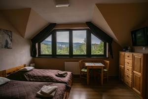 Pokoje Siódme Niebo客房内的一张或多张床位