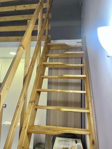 a staircase in a building with wooden rails at Oceania B&B in Genova