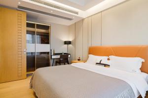 Lova arba lovos apgyvendinimo įstaigoje Raffles Executive Apartment - Guangzhou Huijin International Finance Center, Keyun Road Metro Station Branch-Canton Fair Free Shuttle