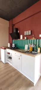 a kitchen with a white counter in a room at Aze's Garden suites - Kalkan, Kaş in Kaş