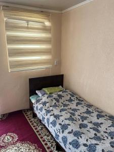 "Bilim" Guest House客房内的一张或多张床位