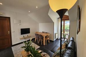 TV a/nebo společenská místnost v ubytování Apartamento El Balcón del Cuera de Llanes