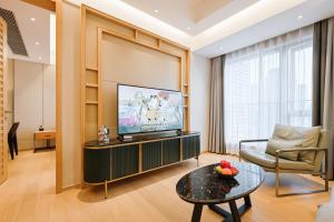 TV a/nebo společenská místnost v ubytování Raffles Executive Apartment - Guangzhou Huijin International Finance Center, Keyun Road Metro Station Branch-Canton Fair Free Shuttle