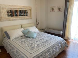 a bedroom with a bed with two pillows on it at Casa Vacanze "Un sogno nel Blu'" in Baunei