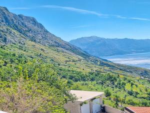a view of a valley with mountains and a lake at House Rinomeri in Lokva Rogoznica
