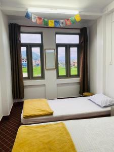 Postel nebo postele na pokoji v ubytování COMMUNITY HOLIDAY INN