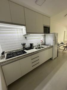 Kuchyň nebo kuchyňský kout v ubytování SP Expo Apto 4 pessoas