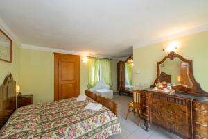 Postel nebo postele na pokoji v ubytování Guesthouse Giulietta e Romeo