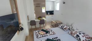 Ένα ή περισσότερα κρεβάτια σε δωμάτιο στο El Higo Apartments