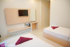 Letto o letti in una camera di Silversand Resort