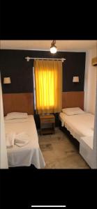 Postel nebo postele na pokoji v ubytování Kılavuz otel